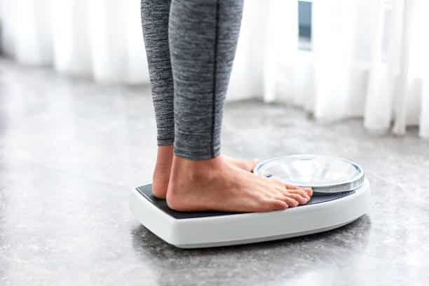 home scales after getting IV therapy for weight loss