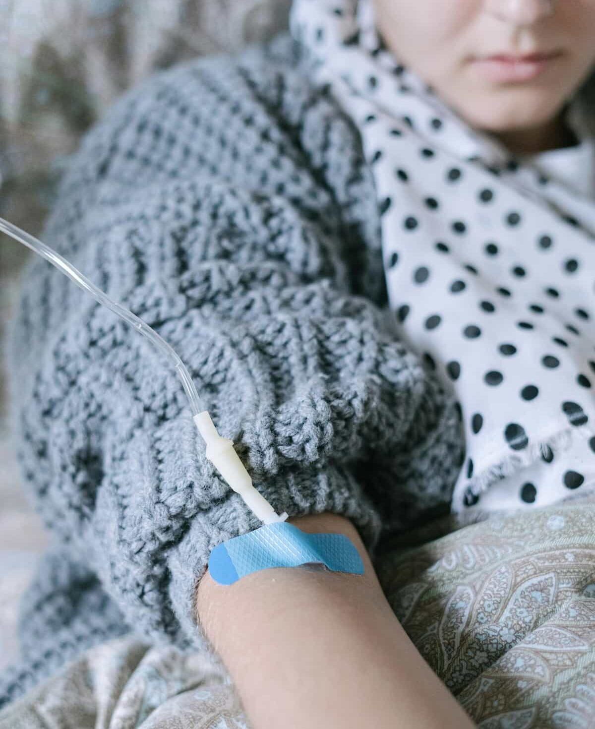 Person in Gray and White Polka Dot Long Sleeve Shirt